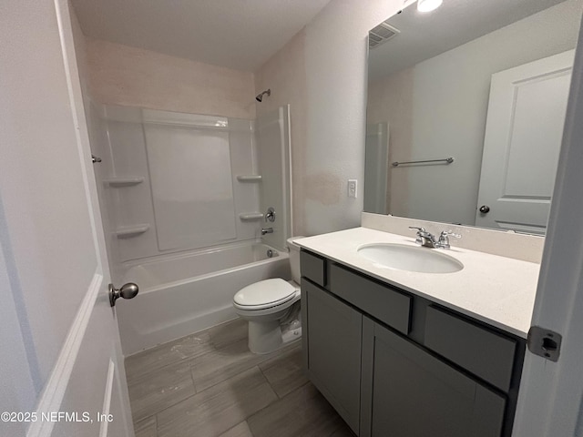 full bathroom with toilet,  shower combination, and vanity