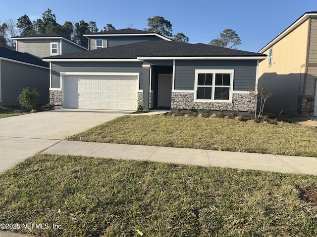 view of front of home with stone siding, concrete driveway, an attached garage, and a front yard