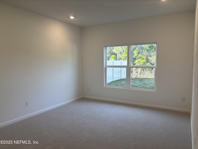 carpeted spare room with baseboards and recessed lighting