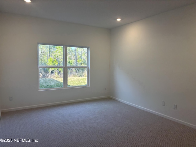 carpeted empty room with recessed lighting and baseboards