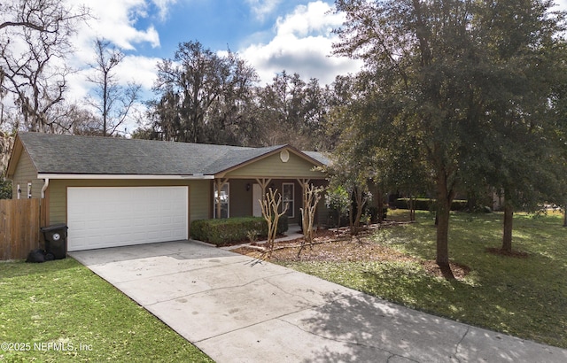 ranch-style house featuring a garage and a front lawn