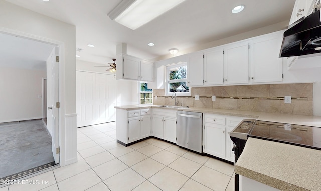 kitchen featuring sink, white cabinetry, light tile patterned floors, dishwasher, and decorative backsplash