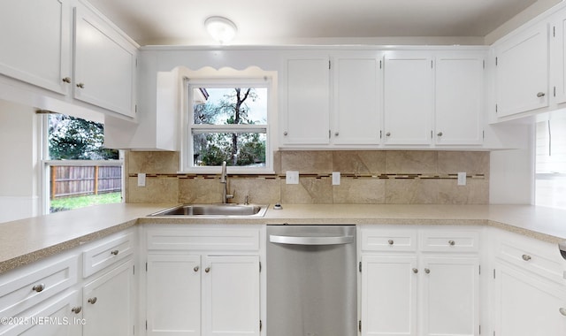 kitchen with white cabinetry, sink, tasteful backsplash, and stainless steel dishwasher