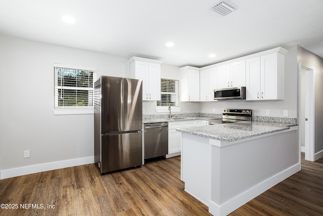 kitchen featuring sink, white cabinets, and appliances with stainless steel finishes