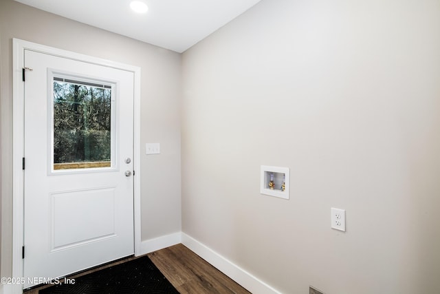 doorway to outside featuring dark wood-type flooring