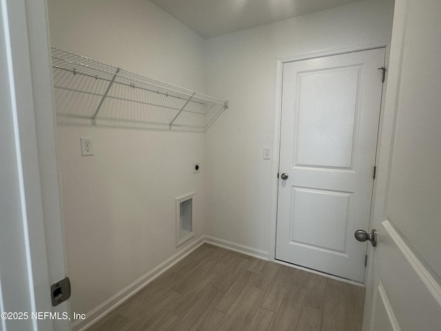 laundry room with laundry area, wood finished floors, baseboards, and hookup for an electric dryer