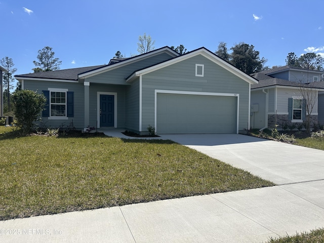 ranch-style house featuring a garage, concrete driveway, and a front yard