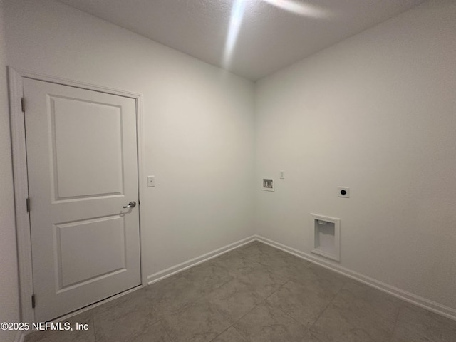 laundry area featuring baseboards, hookup for an electric dryer, hookup for a washing machine, and laundry area