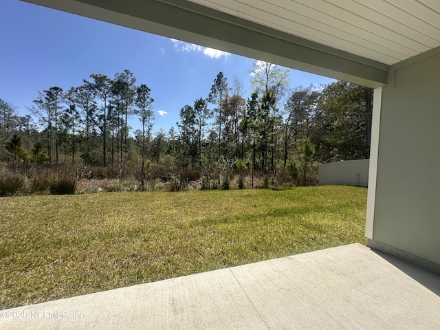 view of yard with a patio and fence