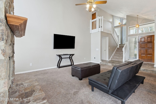 living room featuring ceiling fan, carpet flooring, and high vaulted ceiling