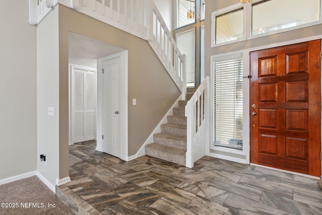 entrance foyer featuring a high ceiling