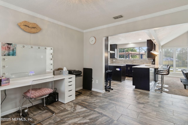 office area featuring crown molding and a textured ceiling