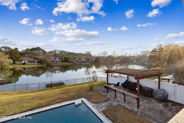 view of pool with a pergola, a lawn, and a water view