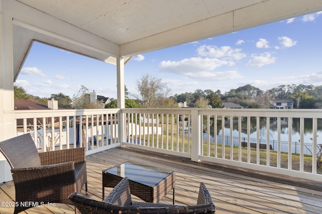 deck featuring a water view