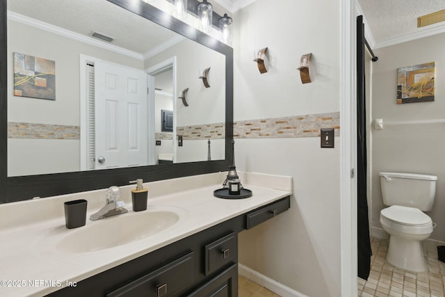 bathroom featuring crown molding, vanity, toilet, and a textured ceiling