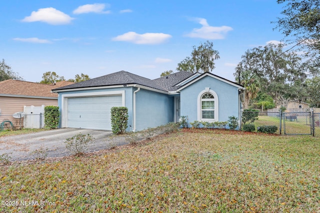 ranch-style home with a garage and a front yard