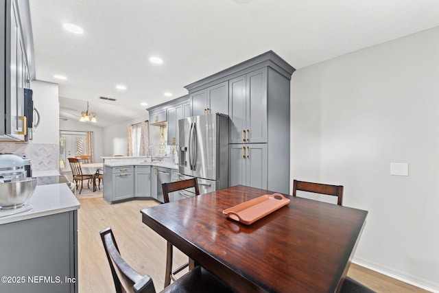 dining area with light wood-type flooring