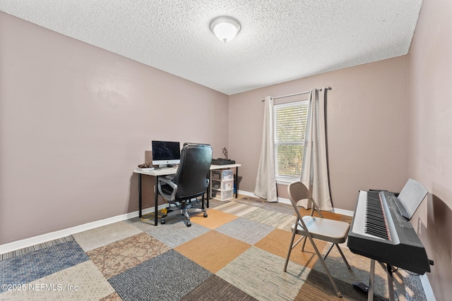 office area with a textured ceiling