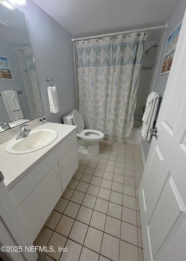4250 A1A S Unit L16, Saint Augustine, FL 32080 - full bath with toilet, shower / bath combination with curtain, tile patterned flooring, and vanity