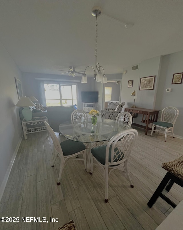 4250 A1A S Unit L16, Saint Augustine, FL 32080 - dining room with baseboards, visible vents, ceiling fan, and light wood-type flooring