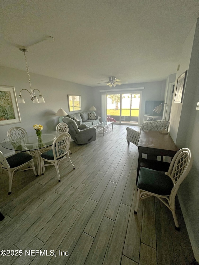 4250 A1A S Unit L16, Saint Augustine, FL 32080 - living area featuring ceiling fan with notable chandelier and wood finished floors