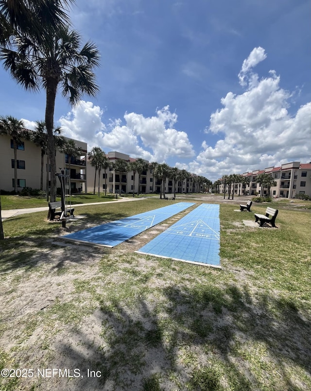 4250 A1A S Unit L16, Saint Augustine, FL 32080 - view of property's community featuring shuffleboard and a lawn
