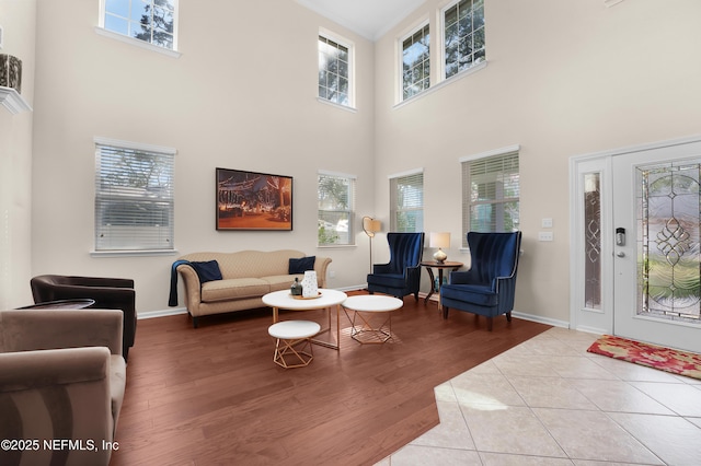 living room with a healthy amount of sunlight and light hardwood / wood-style floors