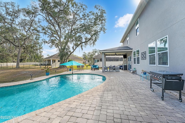 view of swimming pool featuring a patio area