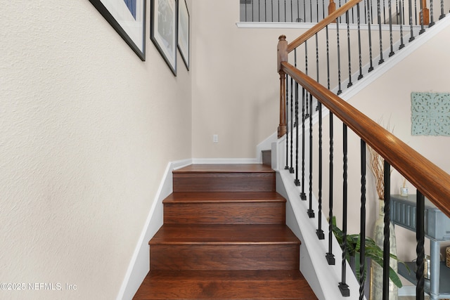 staircase featuring hardwood / wood-style floors