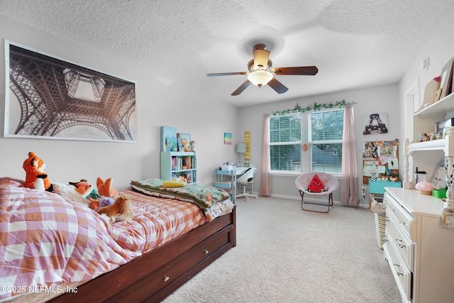 bedroom with light carpet, a textured ceiling, and ceiling fan