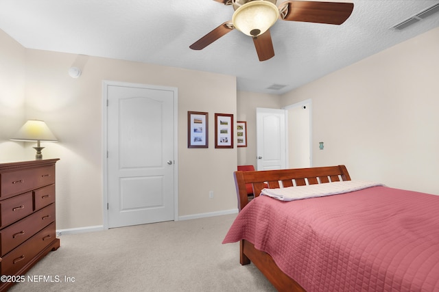 bedroom with ceiling fan and light carpet