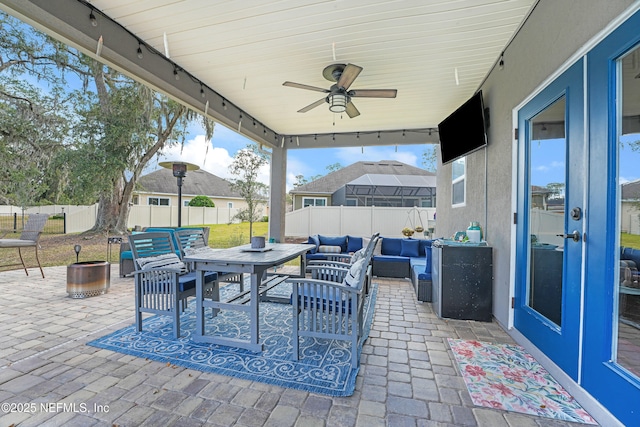 view of patio featuring an outdoor hangout area, french doors, and ceiling fan