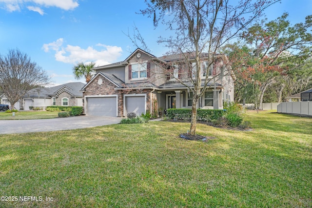 view of front of property with a garage and a front lawn