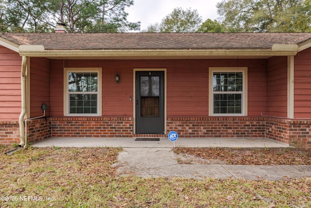 property entrance with a patio