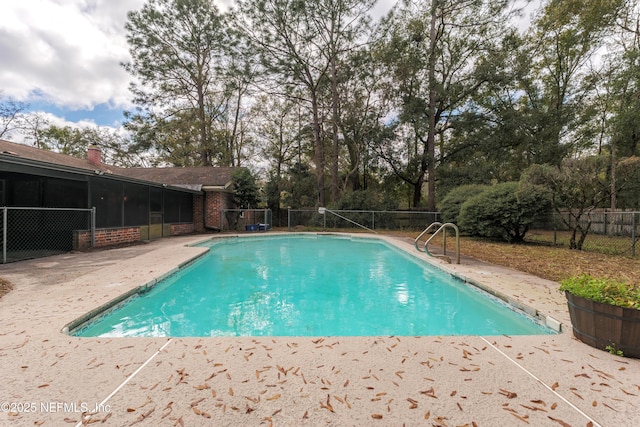 view of swimming pool featuring a patio