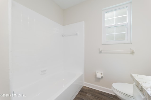 full bathroom with vanity, hardwood / wood-style floors, toilet, and shower / bath combination