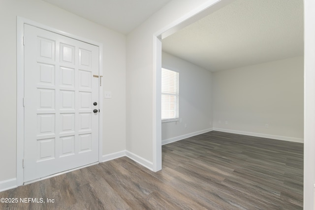 foyer with dark hardwood / wood-style floors