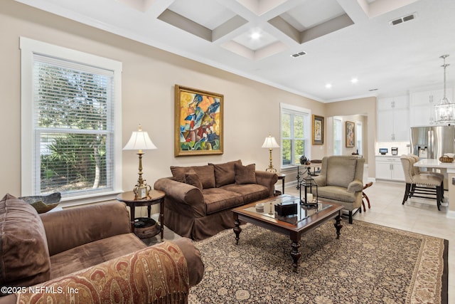 tiled living room featuring beamed ceiling, crown molding, coffered ceiling, and a notable chandelier