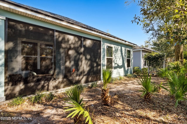 view of home's exterior featuring a sunroom