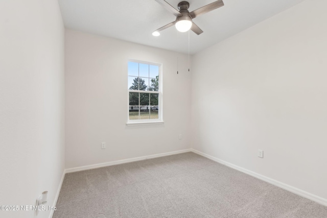 unfurnished room with ceiling fan and carpet floors