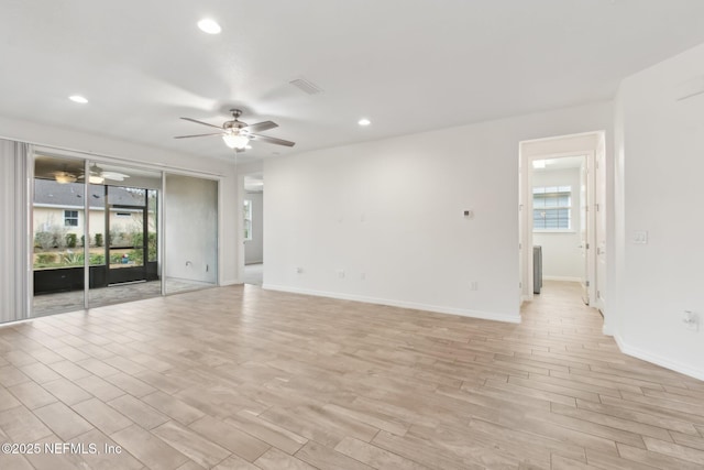 unfurnished room with ceiling fan and light hardwood / wood-style floors