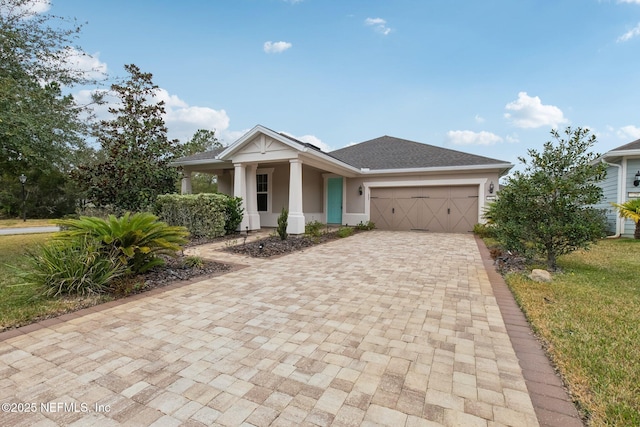 view of front of property with a garage