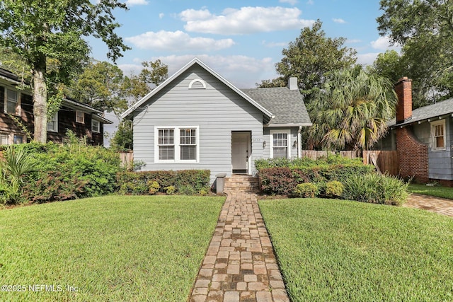 view of front of home with a front lawn