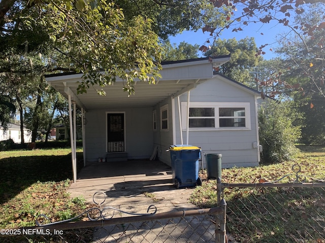 view of front of property with a carport