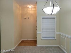 unfurnished dining area with carpet floors