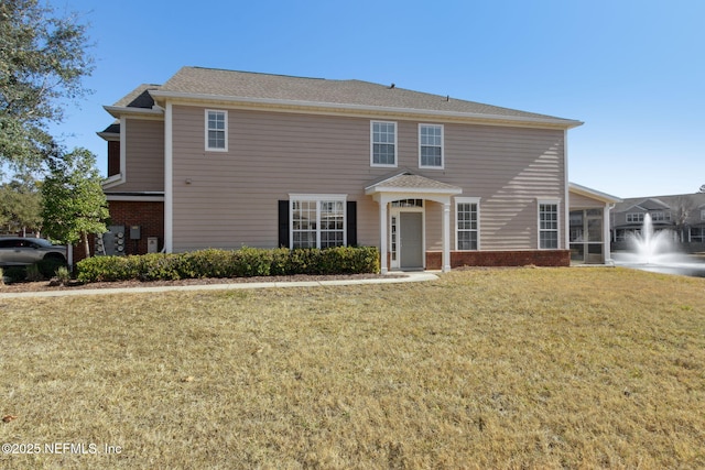 view of front of home with a front lawn