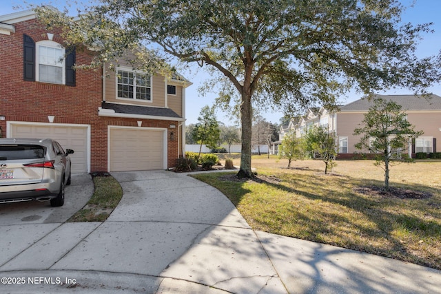 view of front facade featuring a garage and a front yard