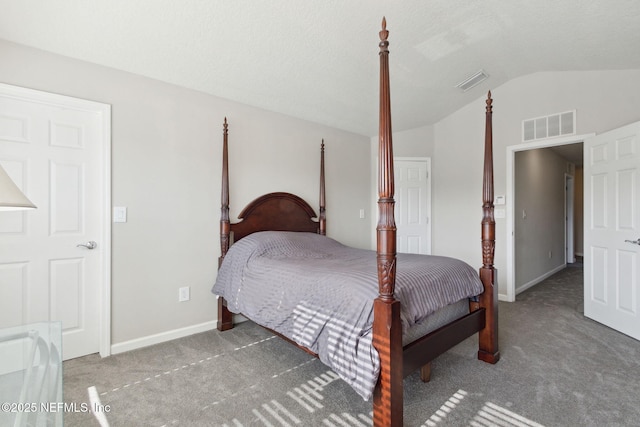 bedroom featuring dark carpet and vaulted ceiling