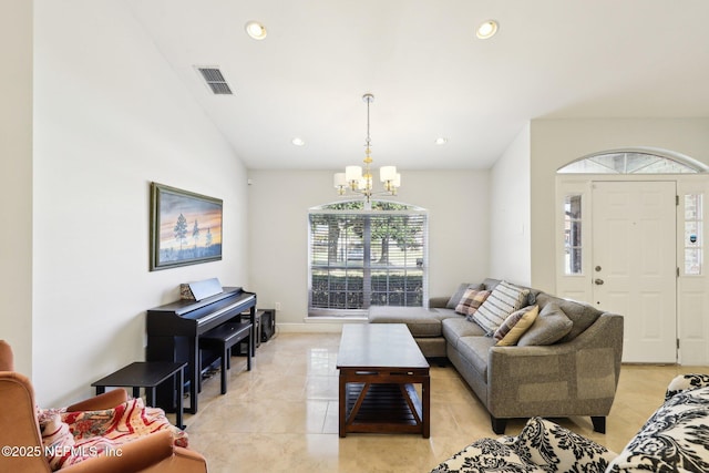 living area with light tile patterned floors, recessed lighting, visible vents, and an inviting chandelier