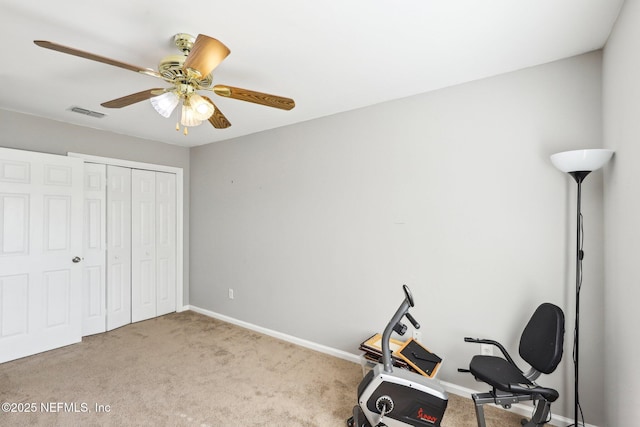 exercise area with light carpet, ceiling fan, visible vents, and baseboards